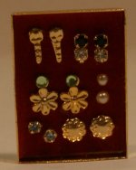 Earrings Display Burgandy Background by Patsy-Mac