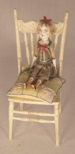 Doll Sitting on Cream Chair by Gale Elena Bantock