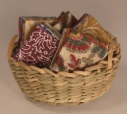 Folded Fabric in Basket by Shepherds