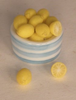 Lemon in Pottery Bowl by Linda Cummings