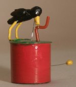 Bird Pulling on Worm Toy by St.Leger