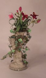 Daylilies in Cherub Statue by Marie Petrik