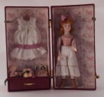 Porcelain Doll in Trunk by Nelly Noorew