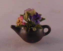 Flowers in Raku Teapot by Pat Richmond